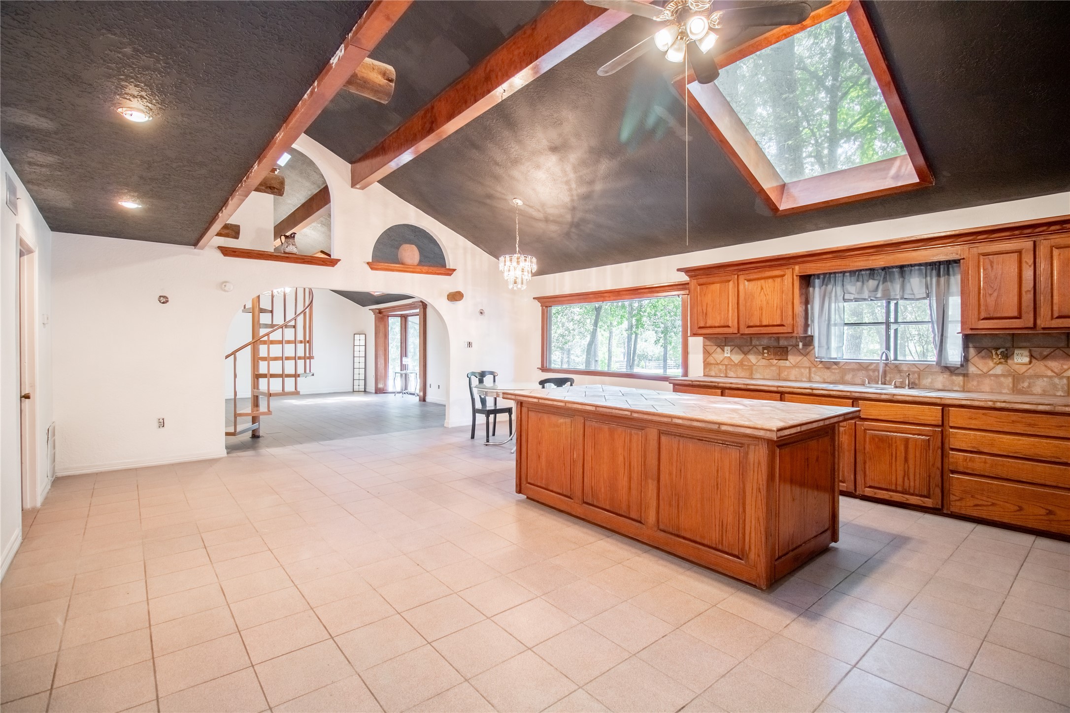27607 Decker Woods Drive Magnolia, TX 77354 - Photo 5 of 48 a large white kitchen with a large window