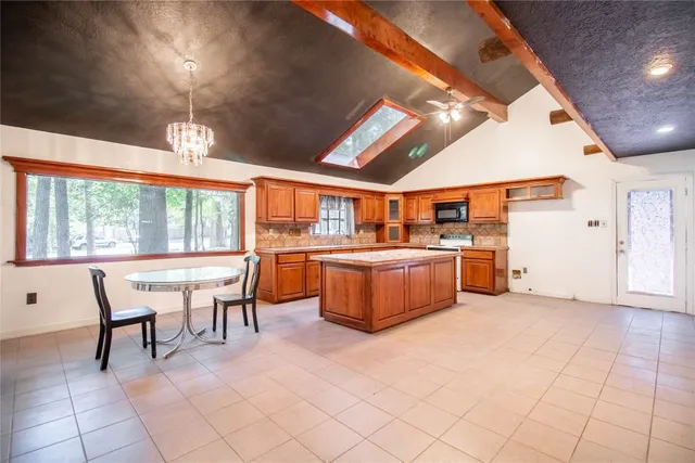 a view of a kitchen and dining room