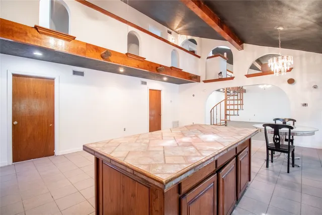 a bath room with a table and chairs