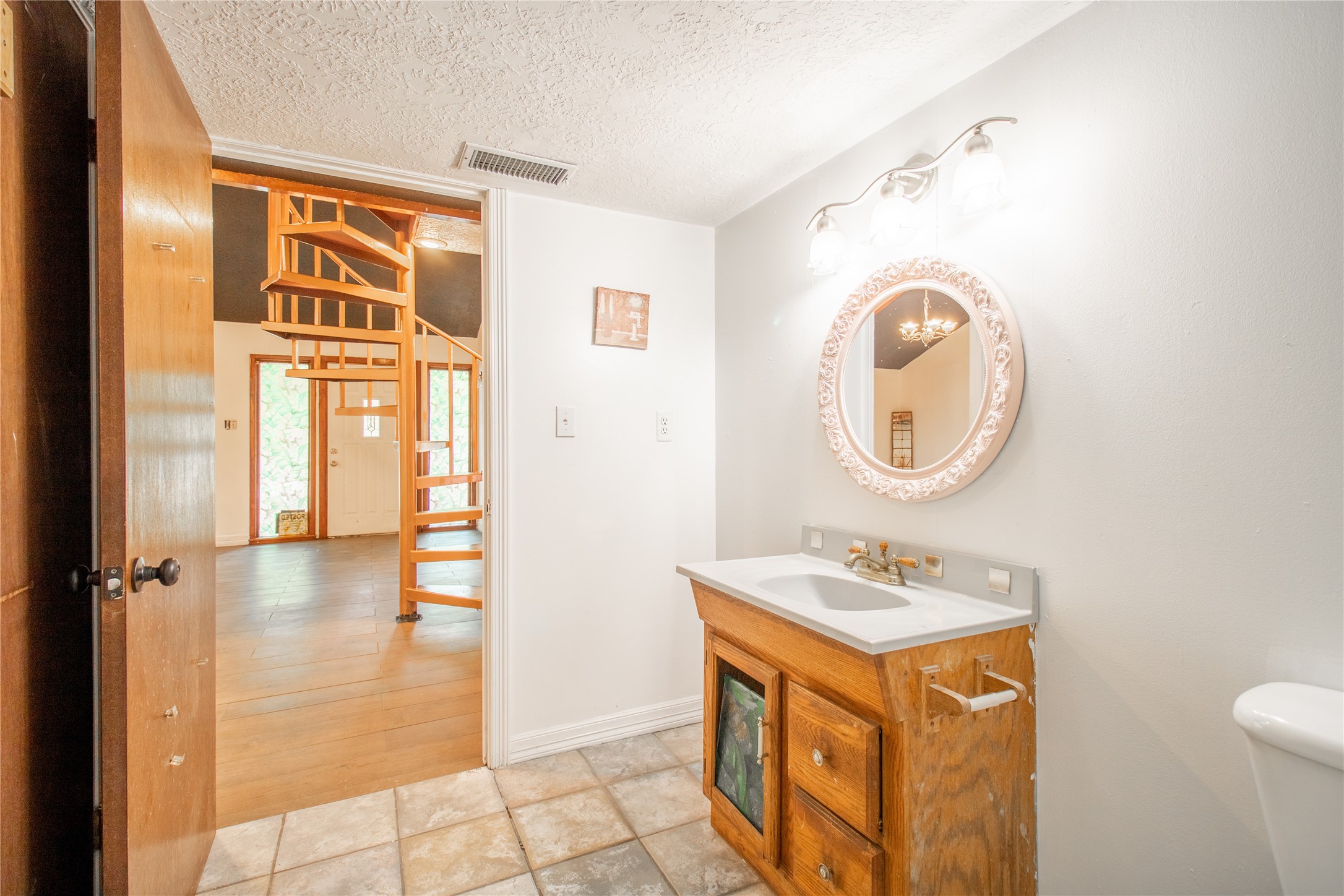 27607 Decker Woods Drive Magnolia, TX 77354 - Photo 10 of 48 a bathroom with a sink a mirror and a shower