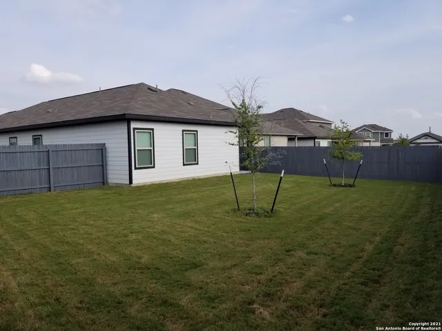a house view with a garden space