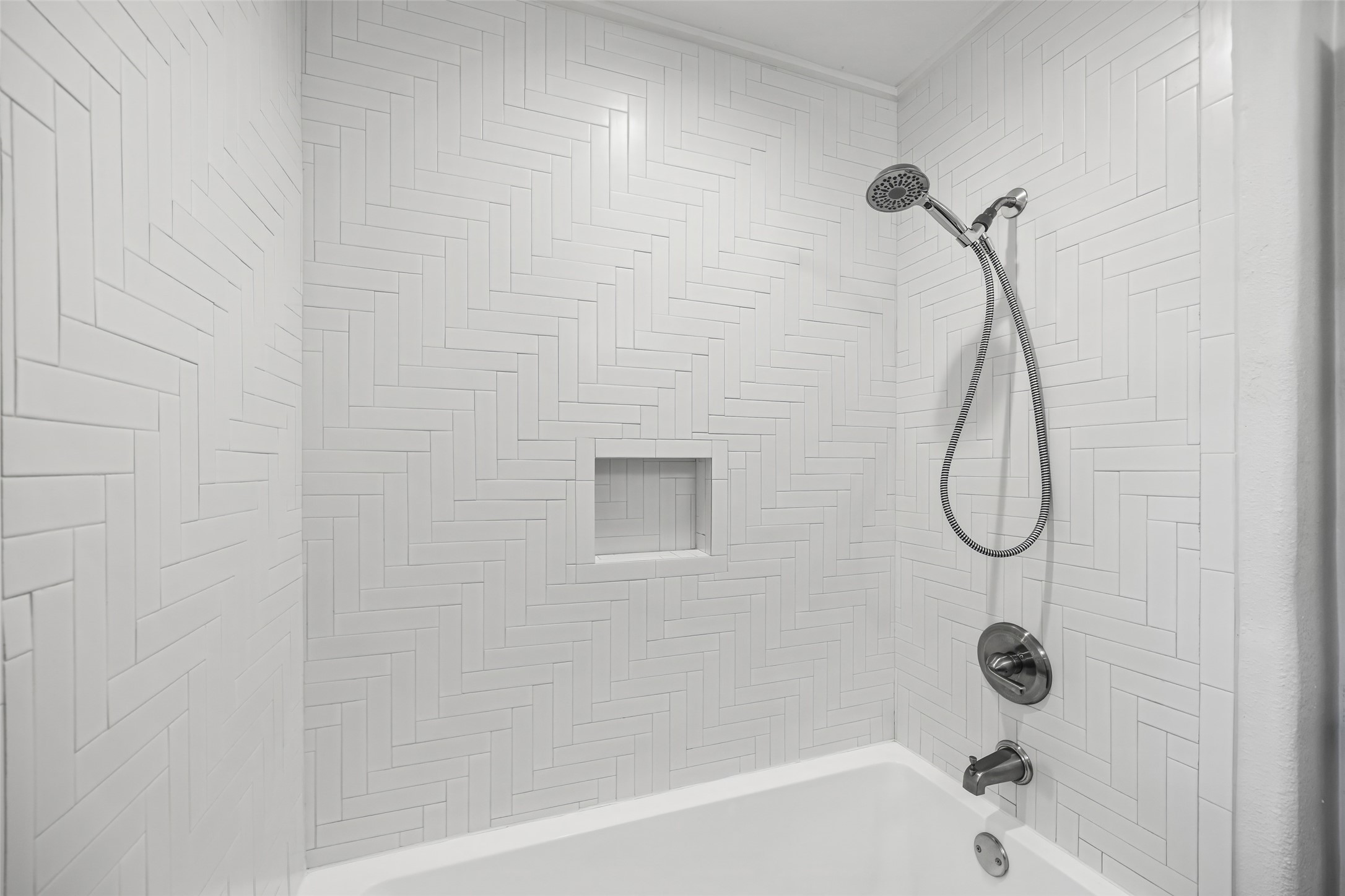 9715 Greenwillow Street Houston, TX 77096 - Photo 19 of 31 a bathroom with a bath tub with a shower