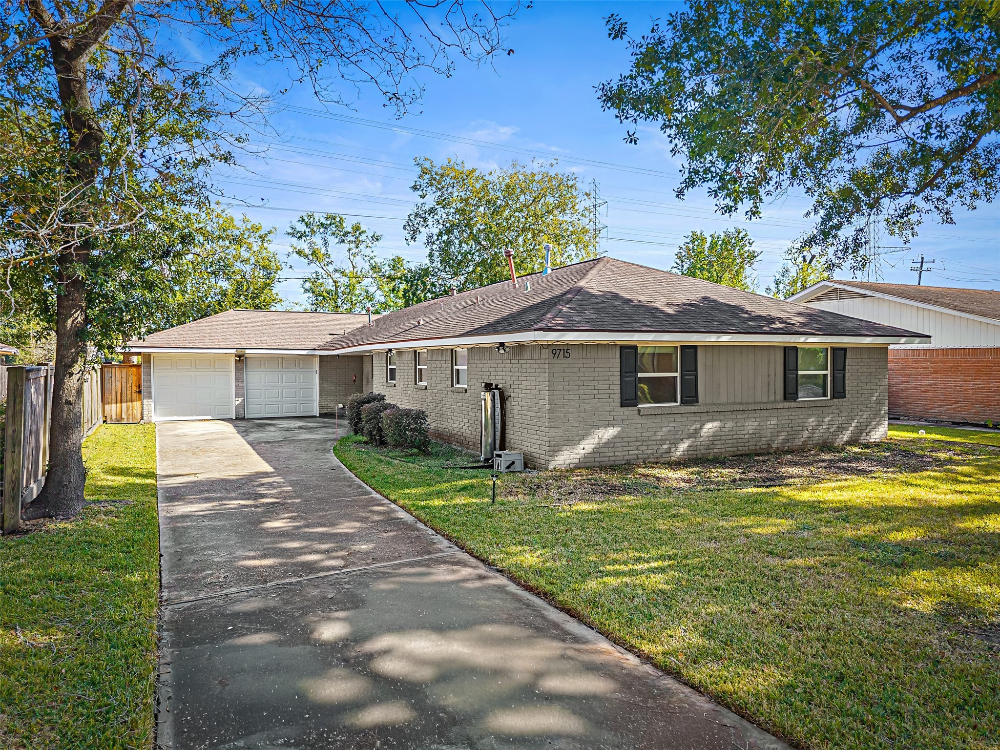 9715 Greenwillow Street Houston, TX 77096 - Photo 2 of 31 a view of a yard in front of house