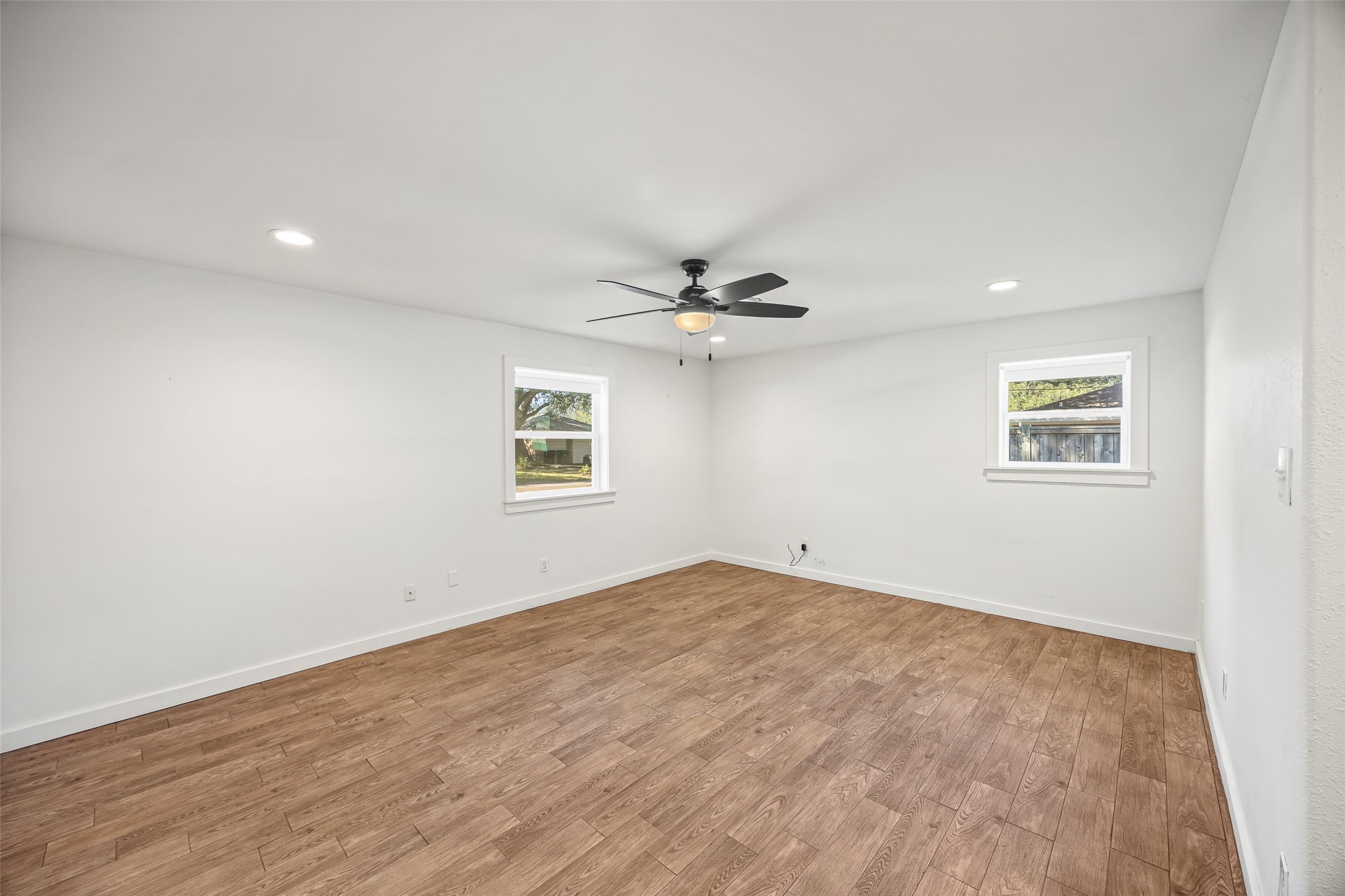9715 Greenwillow Street Houston, TX 77096 - Photo 24 of 31 wooden floor in an empty room with a window