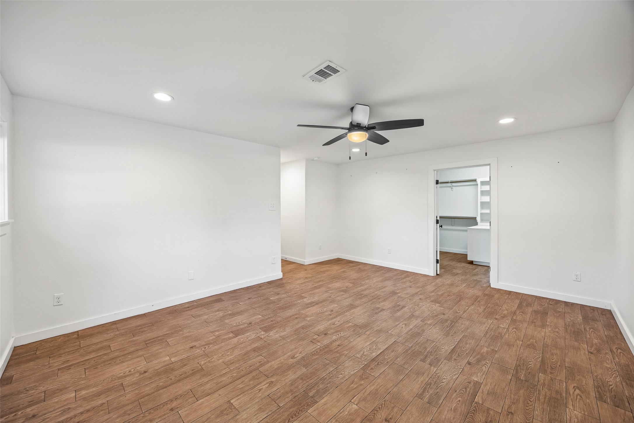 9715 Greenwillow Street Houston, TX 77096 - Photo 25 of 31 a view of empty room with wooden floor