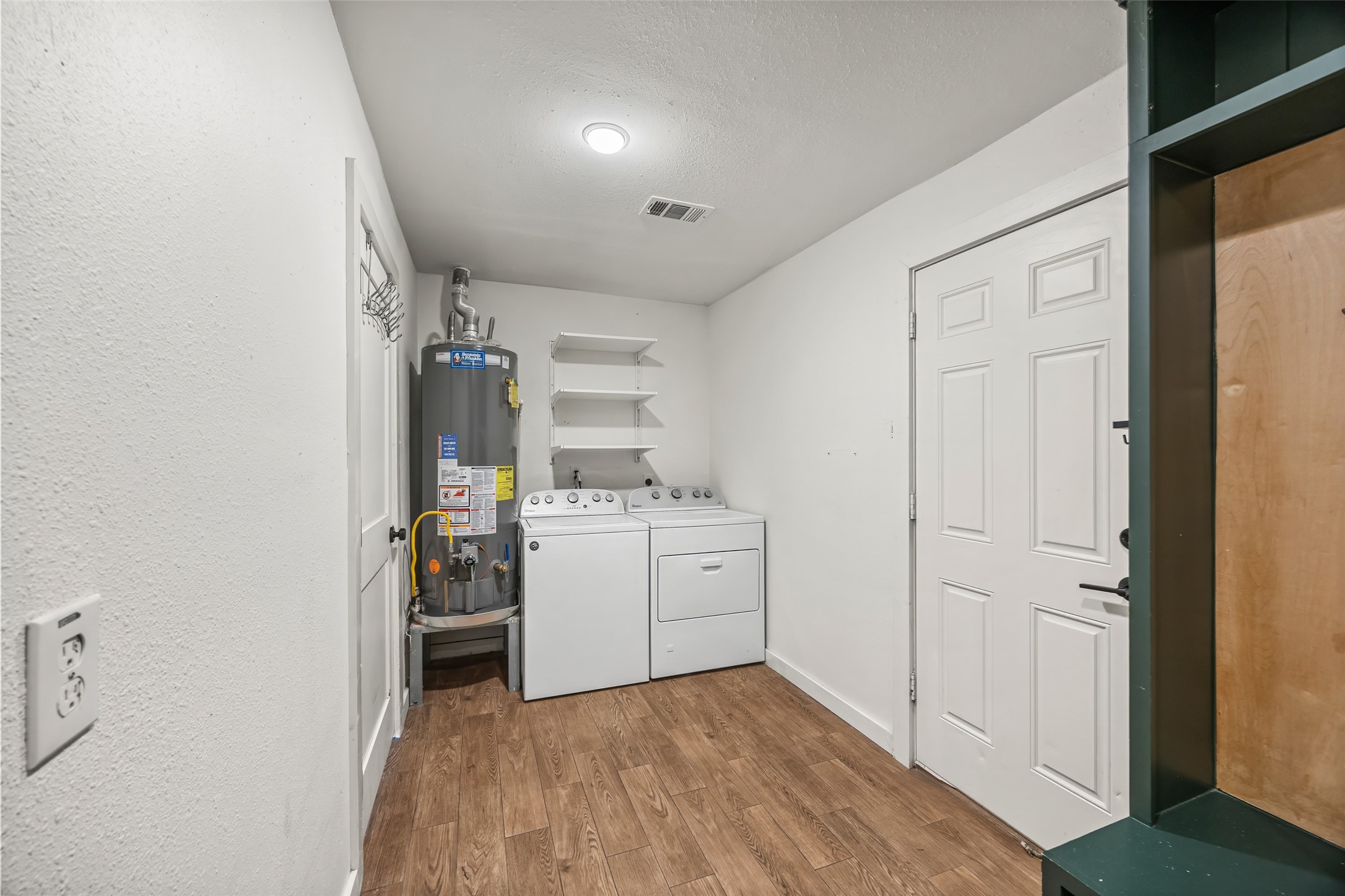 9715 Greenwillow Street Houston, TX 77096 - Photo 28 of 31 a room with storage and utility