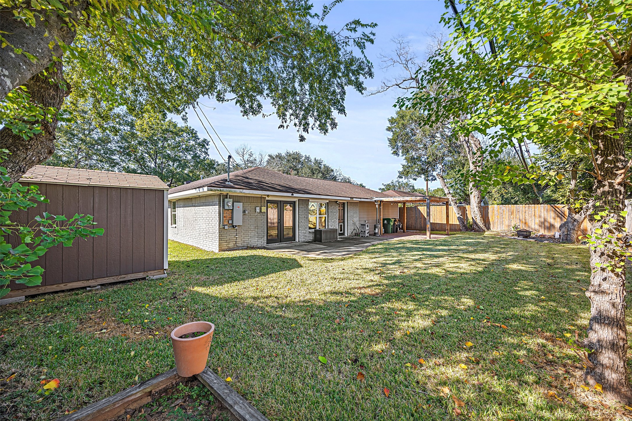 9715 Greenwillow Street Houston, TX 77096 - Photo 29 of 31 a front view of a house with garden
