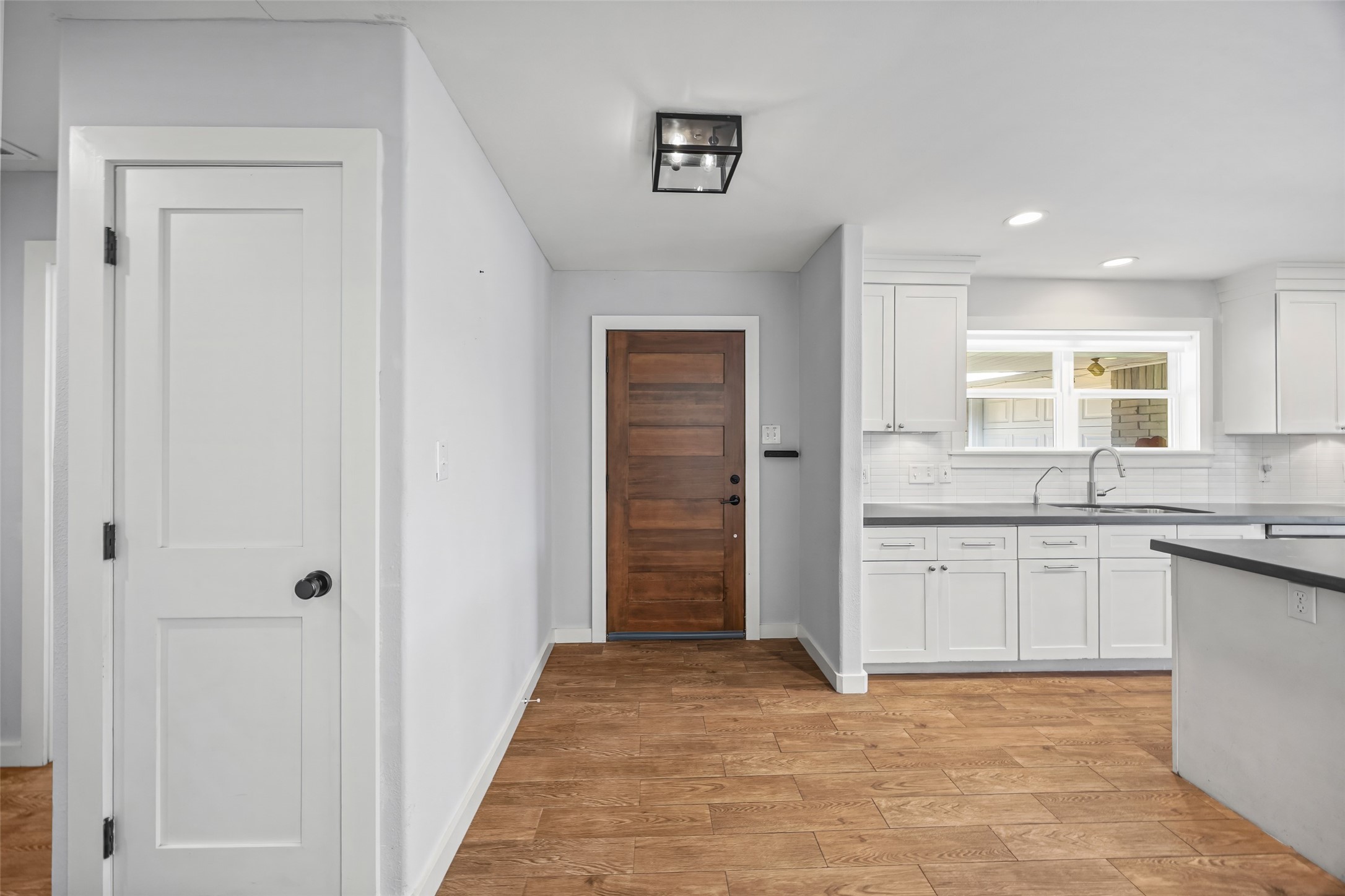 9715 Greenwillow Street Houston, TX 77096 - Photo 4 of 31 a bathroom with a granite countertop sink a mirror a vanity and a bathtub