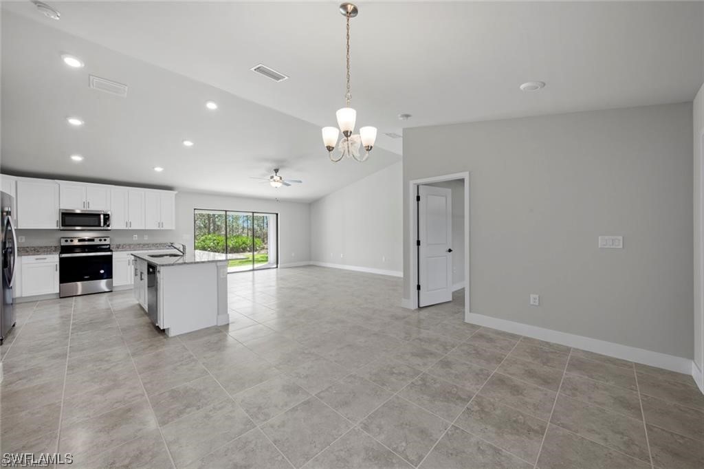 220 Grant Avenue Lehigh Acres, FL 33936 - Photo 2 of 6 a view of a kitchen with a sink and dishwasher with kitchen view