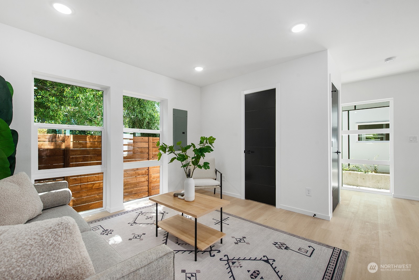 9004 15th Avenue Southwest, Unit A Seattle, WA 98106 - Photo 11 of 20 a living room with furniture and a potted plant