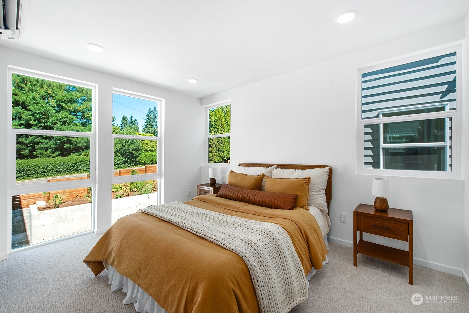 9004 15th Avenue Southwest, Unit A Seattle, WA 98106 - Photo 13 of 20 a bedroom with a bed and a large window