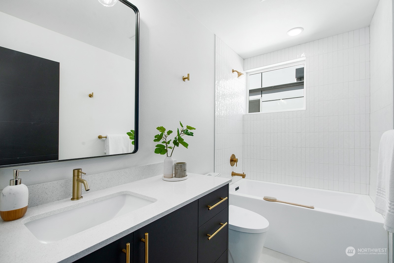 9004 15th Avenue Southwest, Unit A Seattle, WA 98106 - Photo 14 of 20 a bathroom with a sink a toilet and a mirror