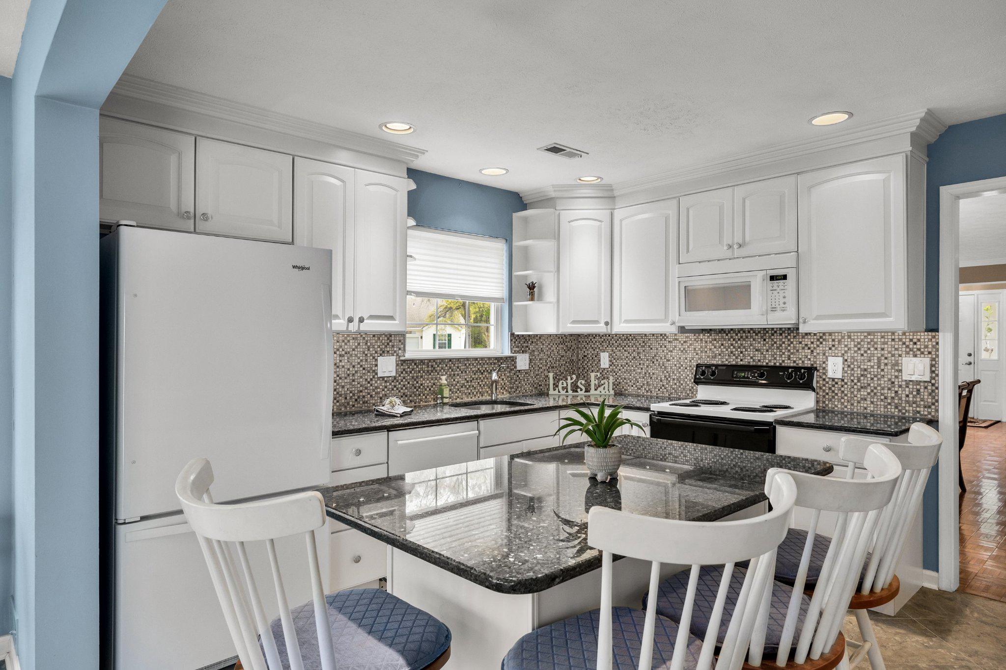11 Bittersweet Place Mount Laurel, NJ 08054 - Photo 20 of 34 a kitchen with stainless steel appliances granite countertop a table chairs sink and cabinets