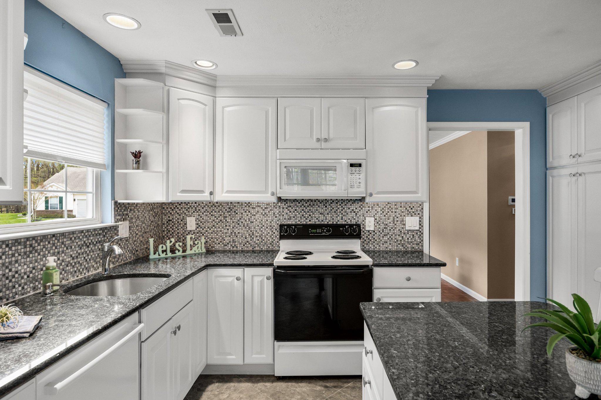 11 Bittersweet Place Mount Laurel, NJ 08054 - Photo 21 of 34 a kitchen with stainless steel appliances granite countertop a stove a sink and a refrigerator