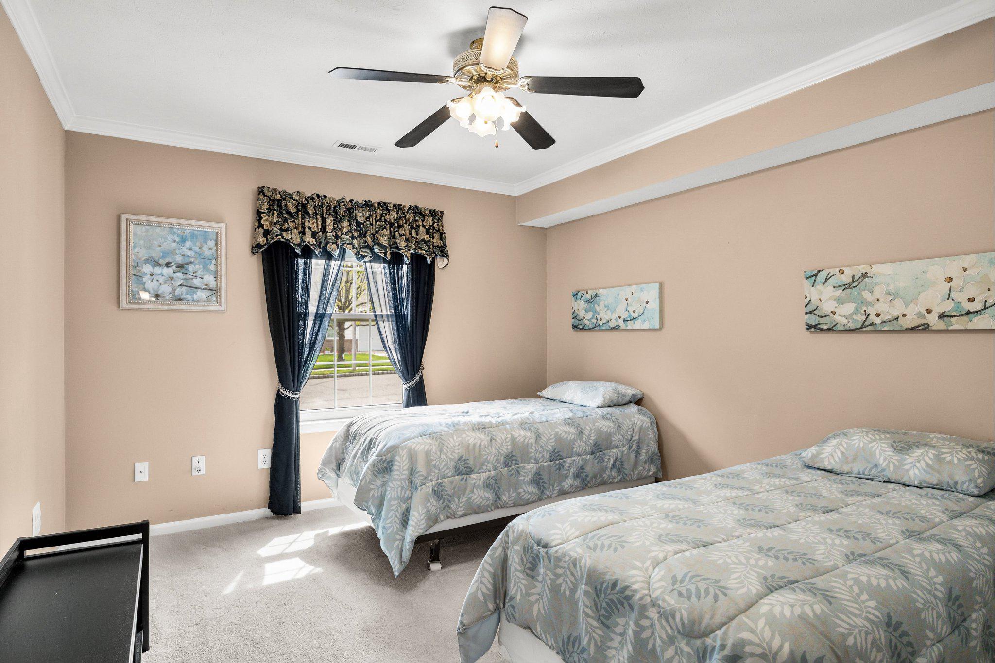 11 Bittersweet Place Mount Laurel, NJ 08054 - Photo 27 of 34 a bedroom with two beds and a chandelier
