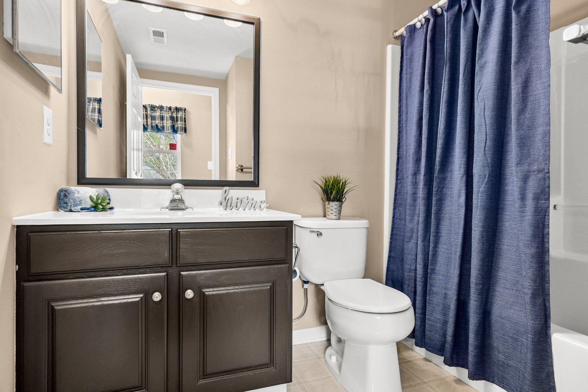 11 Bittersweet Place Mount Laurel, NJ 08054 - Photo 28 of 34 a bathroom with a sink a toilet and a mirror