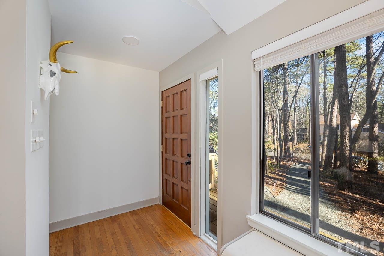 6620 Falconbridge Road Chapel Hill, NC 27517 - Photo 1 of 35 a view of a room with wooden floor and windows