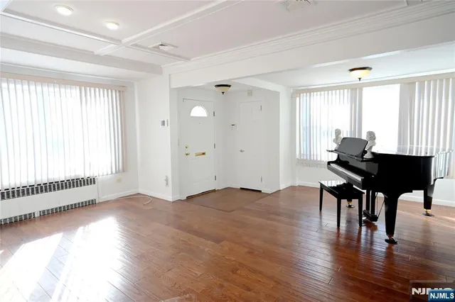 a workspace with furniture window and wooden floor
