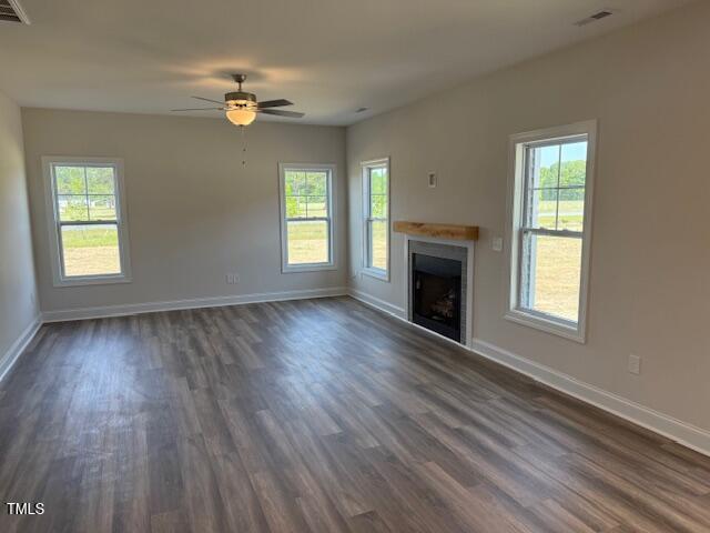 23 Surles Landing Way Benson, NC 27504 - Photo 5 of 18 a view of an empty room with wooden floor and a window