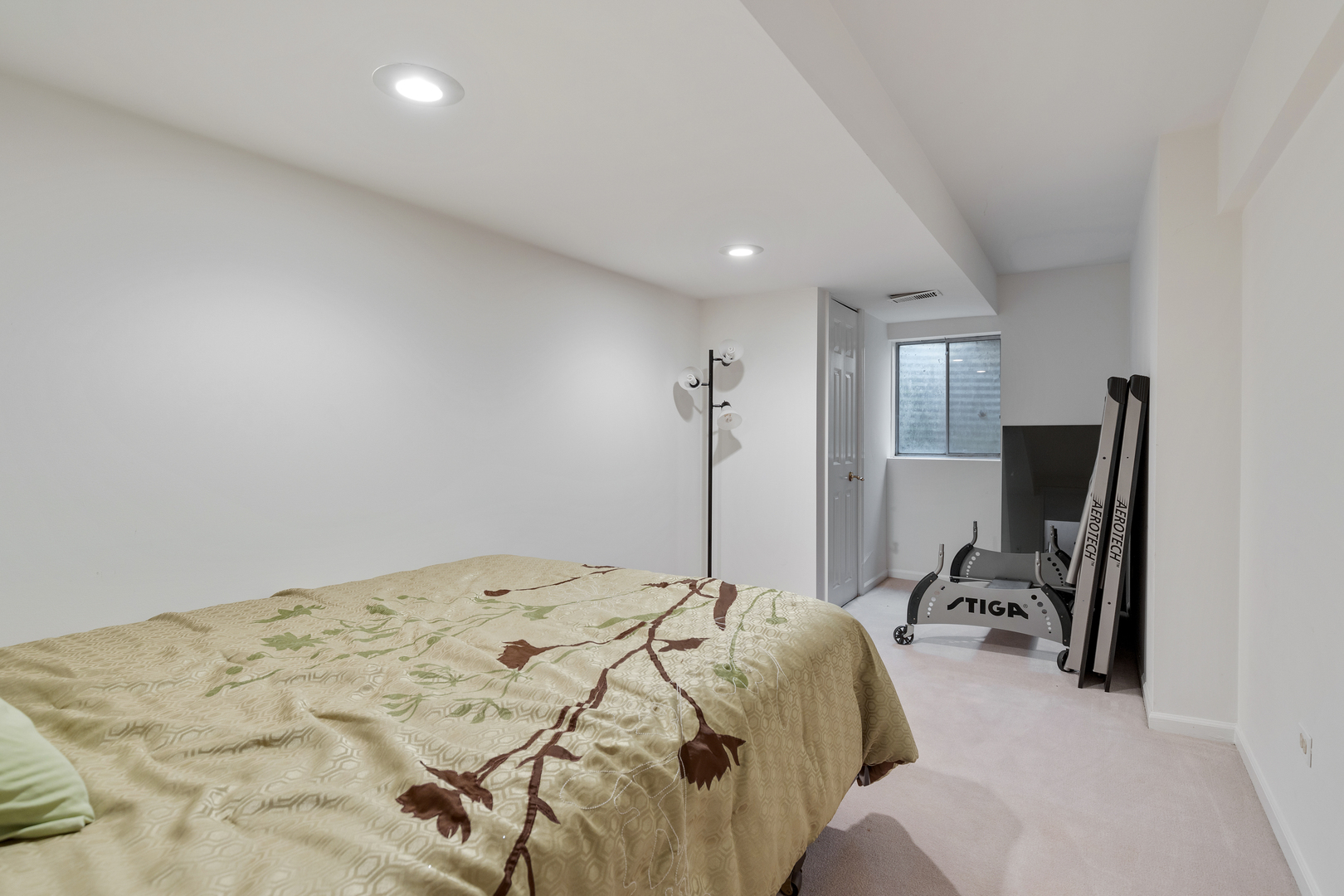 1805 Ashbury Lane, Unit 1805 Inverness, IL 60067 - Photo 14 of 21 a bedroom with a bed a desk and chair