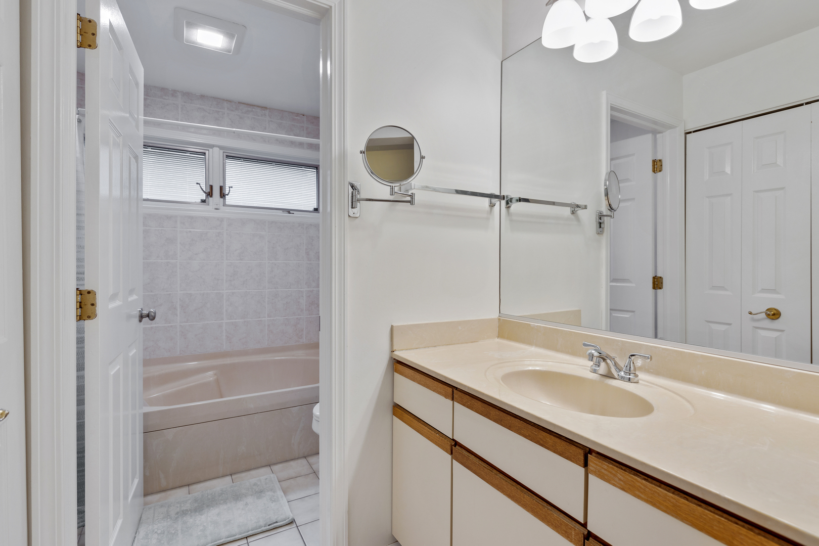 1805 Ashbury Lane, Unit 1805 Inverness, IL 60067 - Photo 15 of 21 a bathroom with a sink vanity granite tub and shower