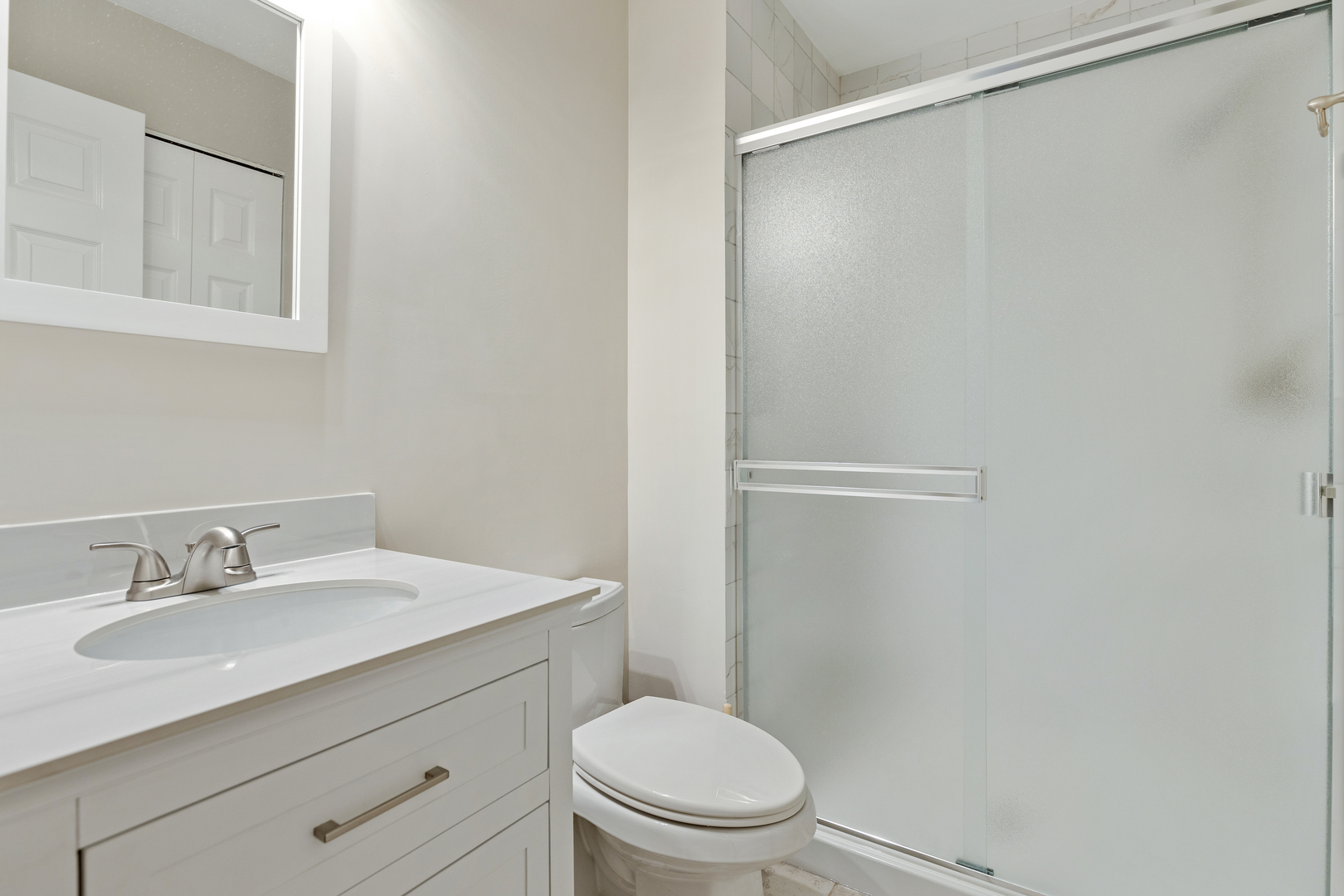 1805 Ashbury Lane, Unit 1805 Inverness, IL 60067 - Photo 17 of 21 a bathroom with a sink toilet and vanity