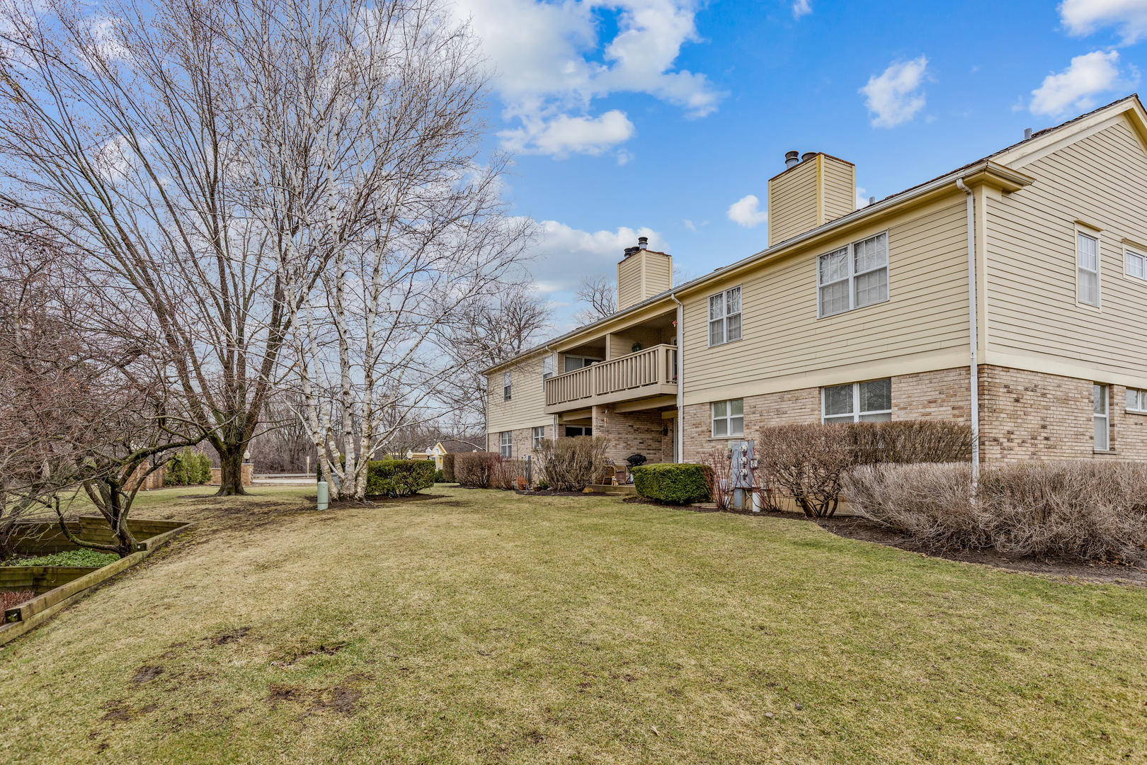1805 Ashbury Lane, Unit 1805 Inverness, IL 60067 - Photo 21 of 21 a view of a house with a yard