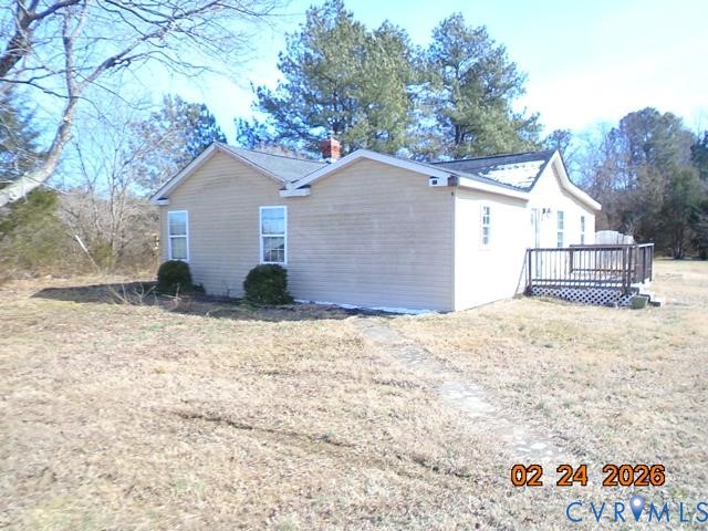 3034 Bradley Farm Road Tappahannock, VA 22560 - Photo 6 of 14 View of home's exterior with a deck, a chimney, an
