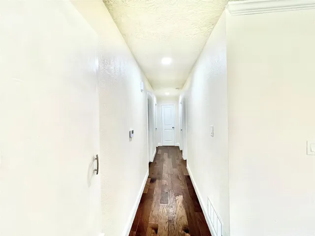 a view of a hallway with a white door