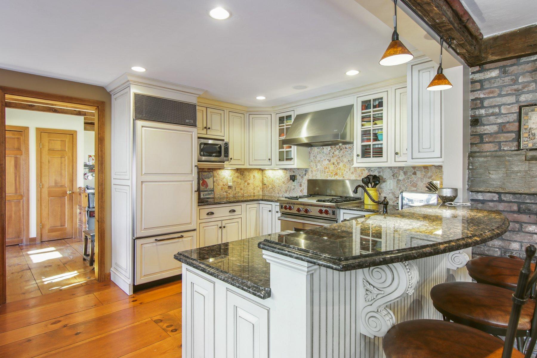 4 Shapquit Bars Road Falmouth, MA 02540 - Photo 13 of 45 a kitchen with kitchen island granite countertop a sink stove and refrigerator