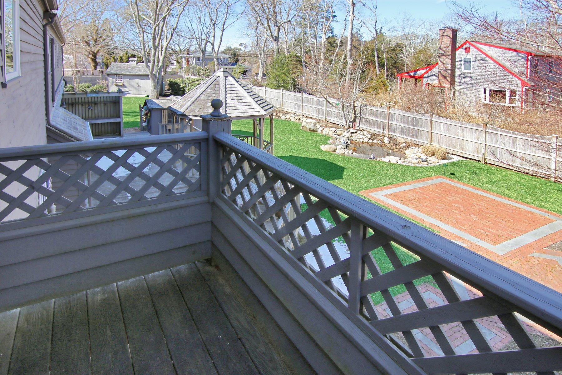 4 Shapquit Bars Road Falmouth, MA 02540 - Photo 18 of 45 a view of a two chairs on the roof deck