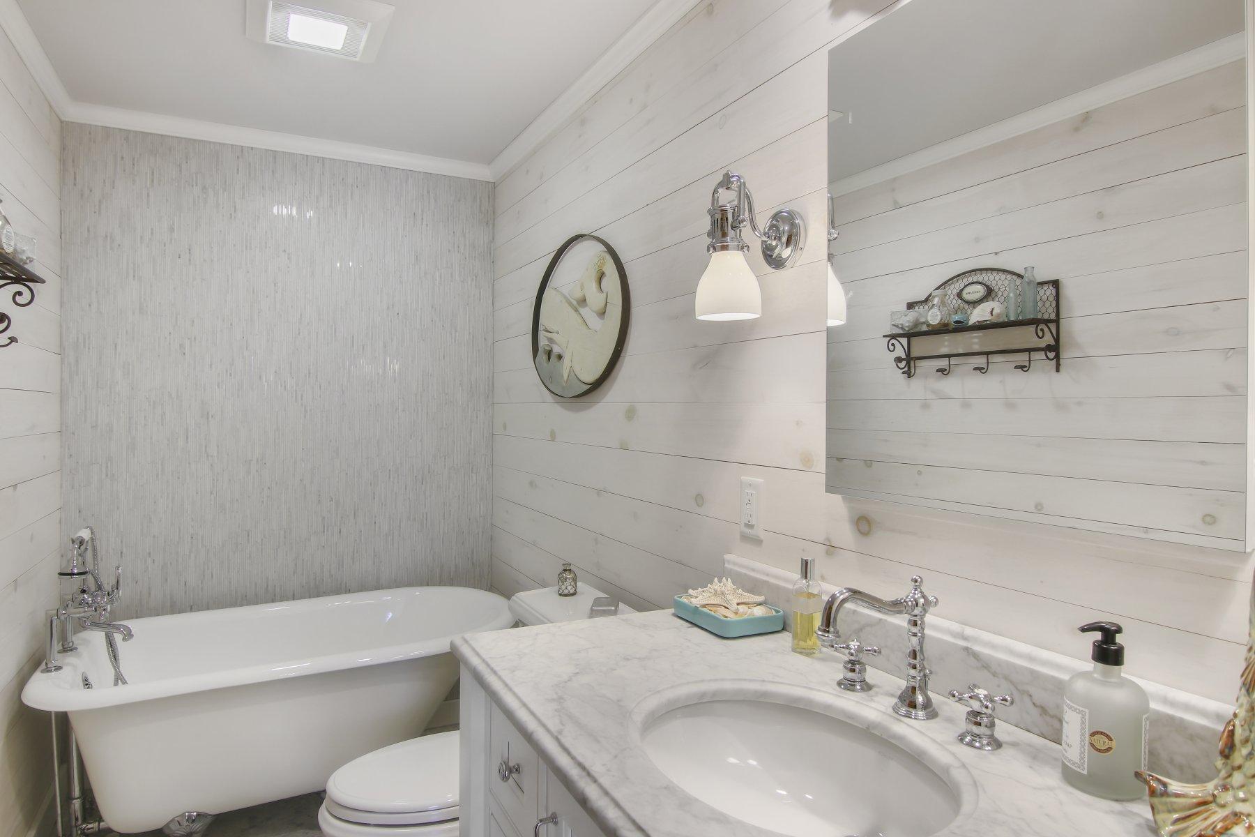 4 Shapquit Bars Road Falmouth, MA 02540 - Photo 22 of 45 a bathroom with a toilet a sink and bathtub