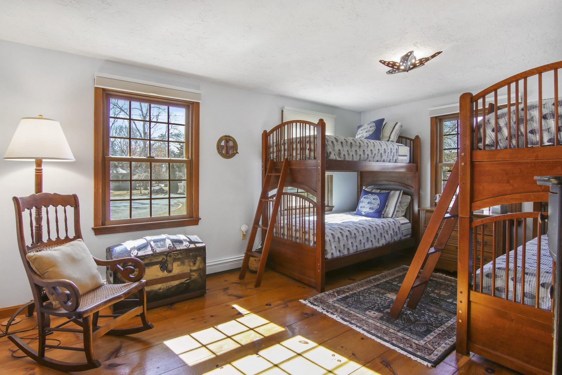 4 Shapquit Bars Road Falmouth, MA 02540 - Photo 23 of 45 a bedroom with furniture and a window