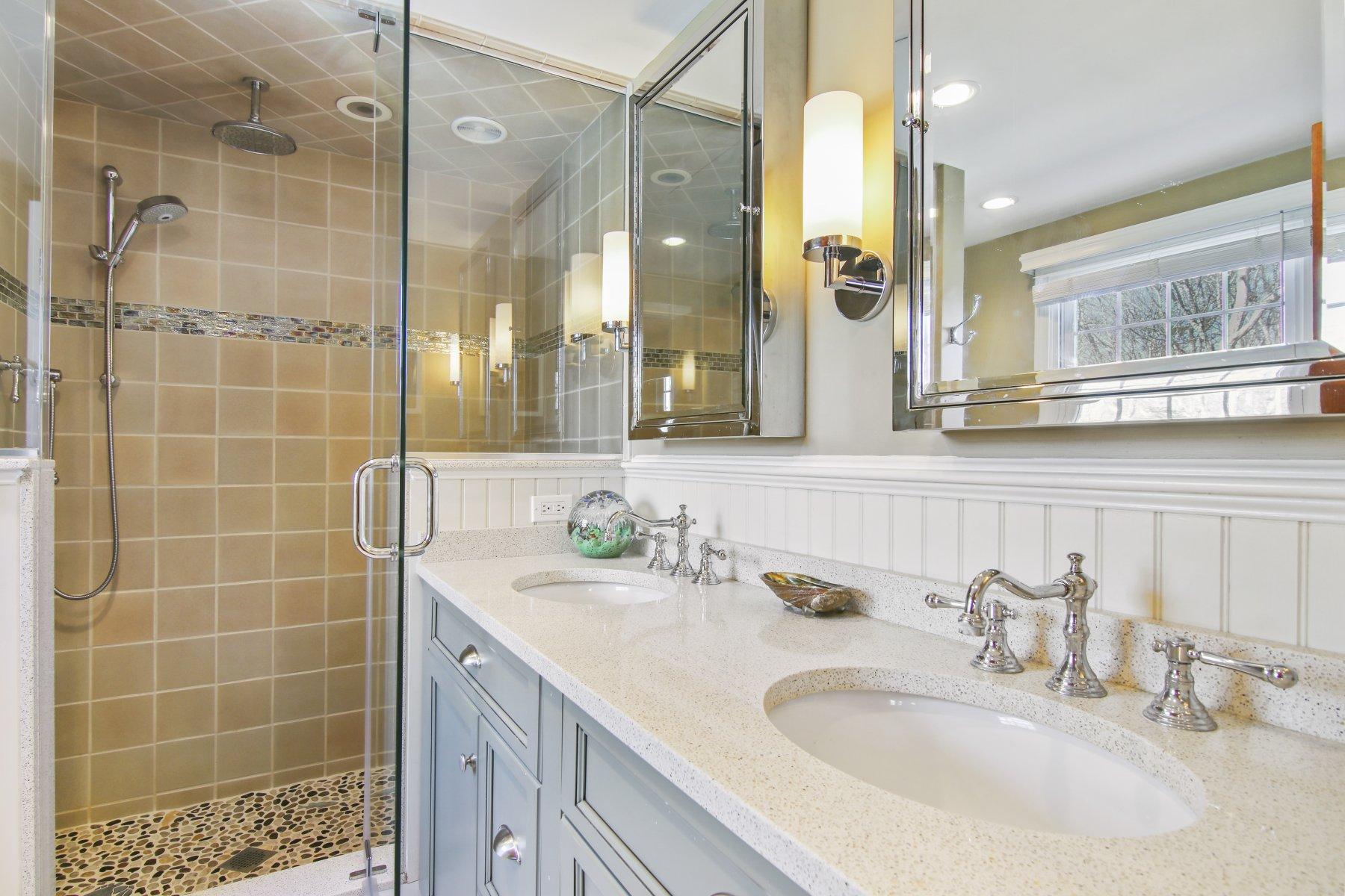 4 Shapquit Bars Road Falmouth, MA 02540 - Photo 25 of 45 a bathroom with a double vanity sink mirror and shower