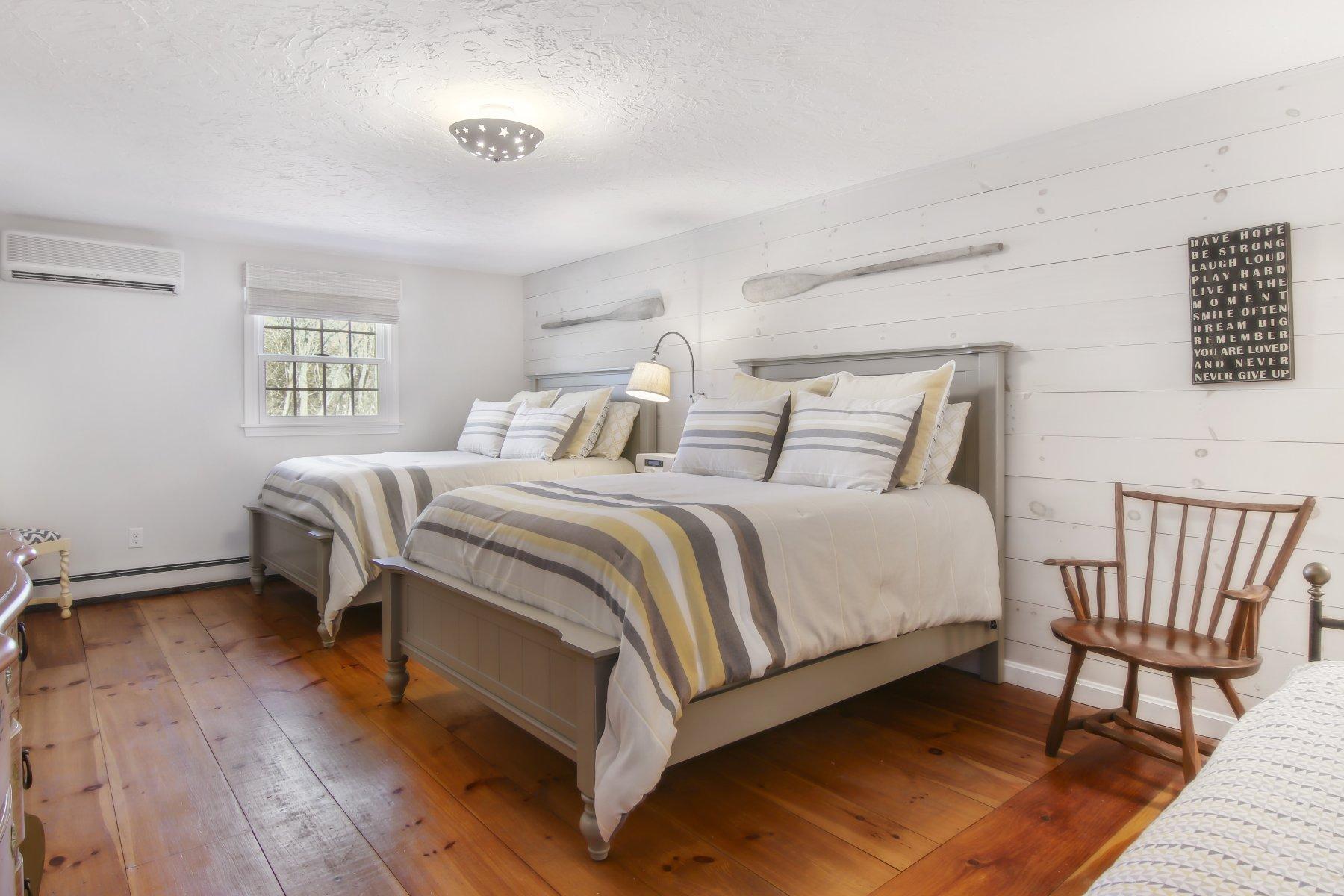 4 Shapquit Bars Road Falmouth, MA 02540 - Photo 27 of 45 a bedroom with a bed and a window