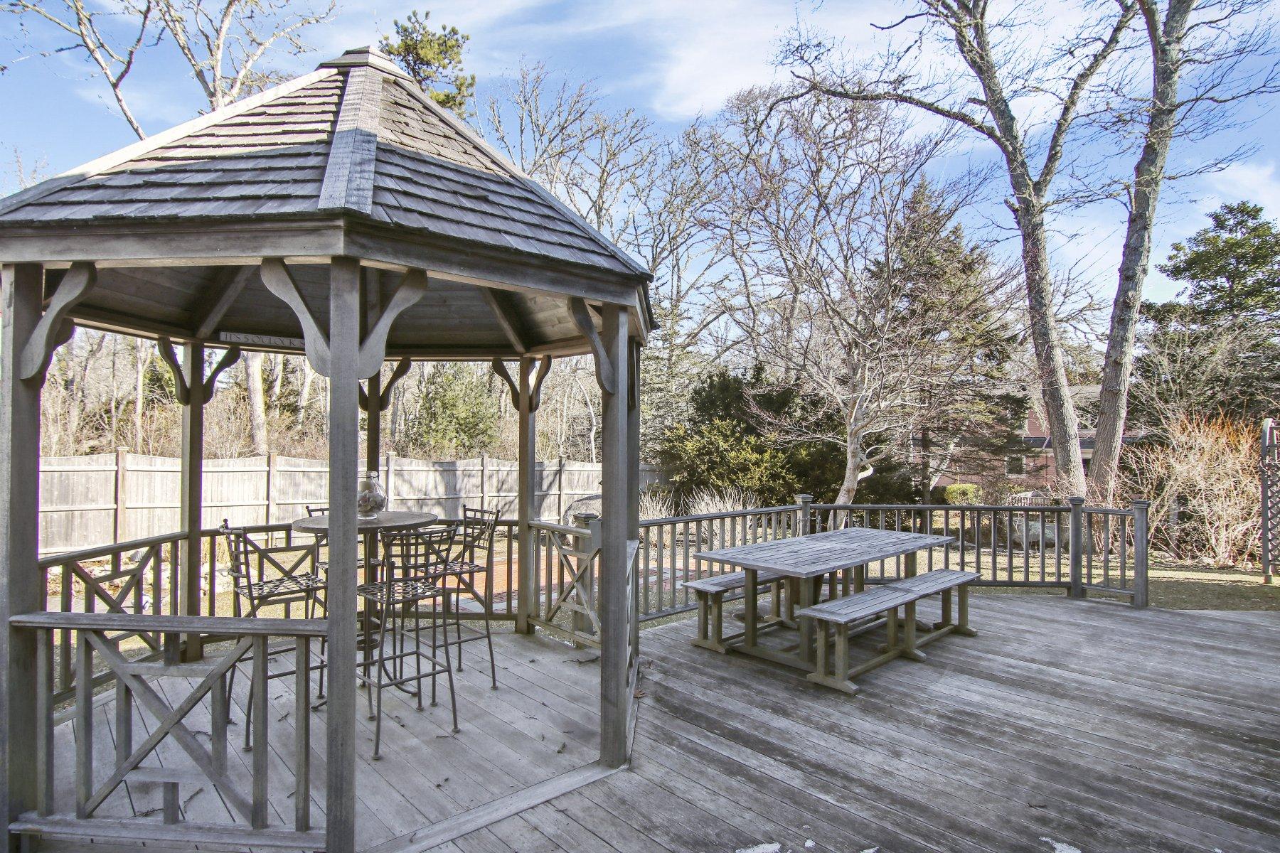 4 Shapquit Bars Road Falmouth, MA 02540 - Photo 30 of 45 a view of a chair and table in the patio