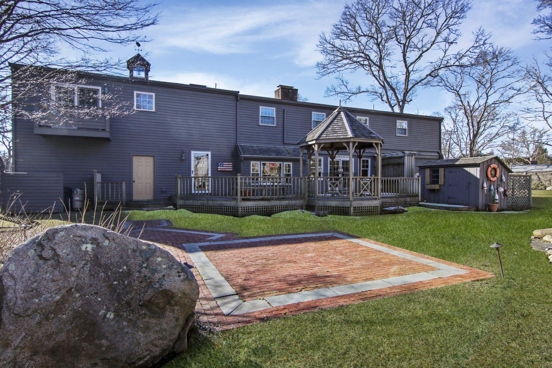 4 Shapquit Bars Road Falmouth, MA 02540 - Photo 33 of 45 a front view of a house with a yard