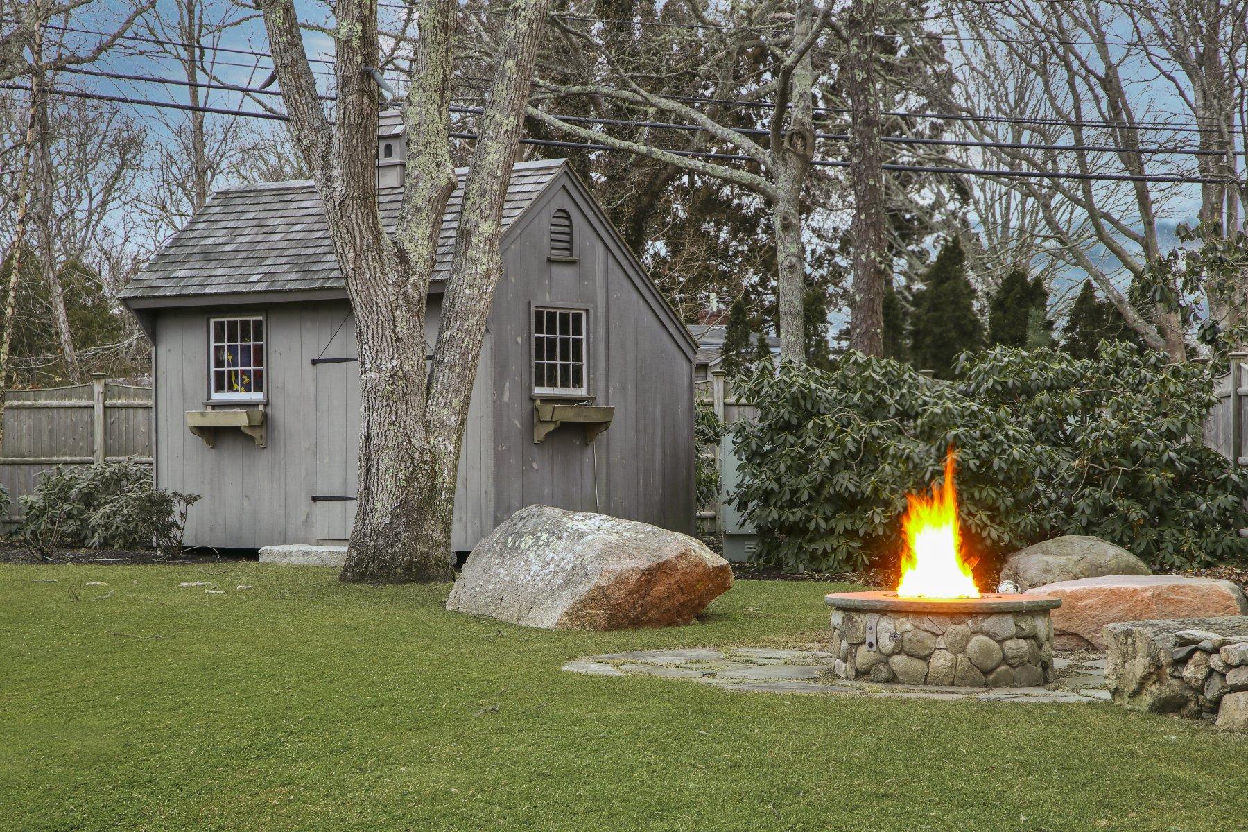 4 Shapquit Bars Road Falmouth, MA 02540 - Photo 37 of 45 a front view of a house with a yard