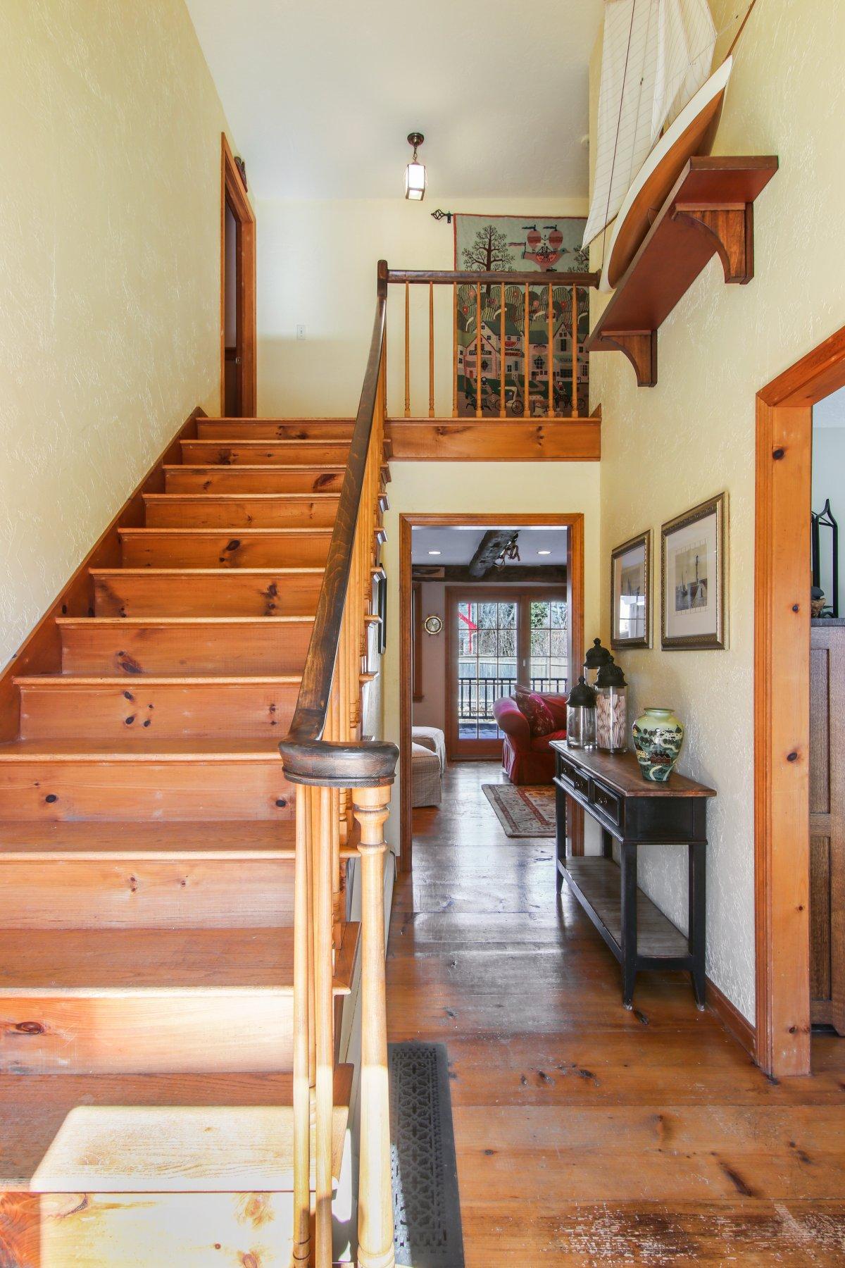 4 Shapquit Bars Road Falmouth, MA 02540 - Photo 5 of 45 a view of entryway livingroom and hall with wooden floor