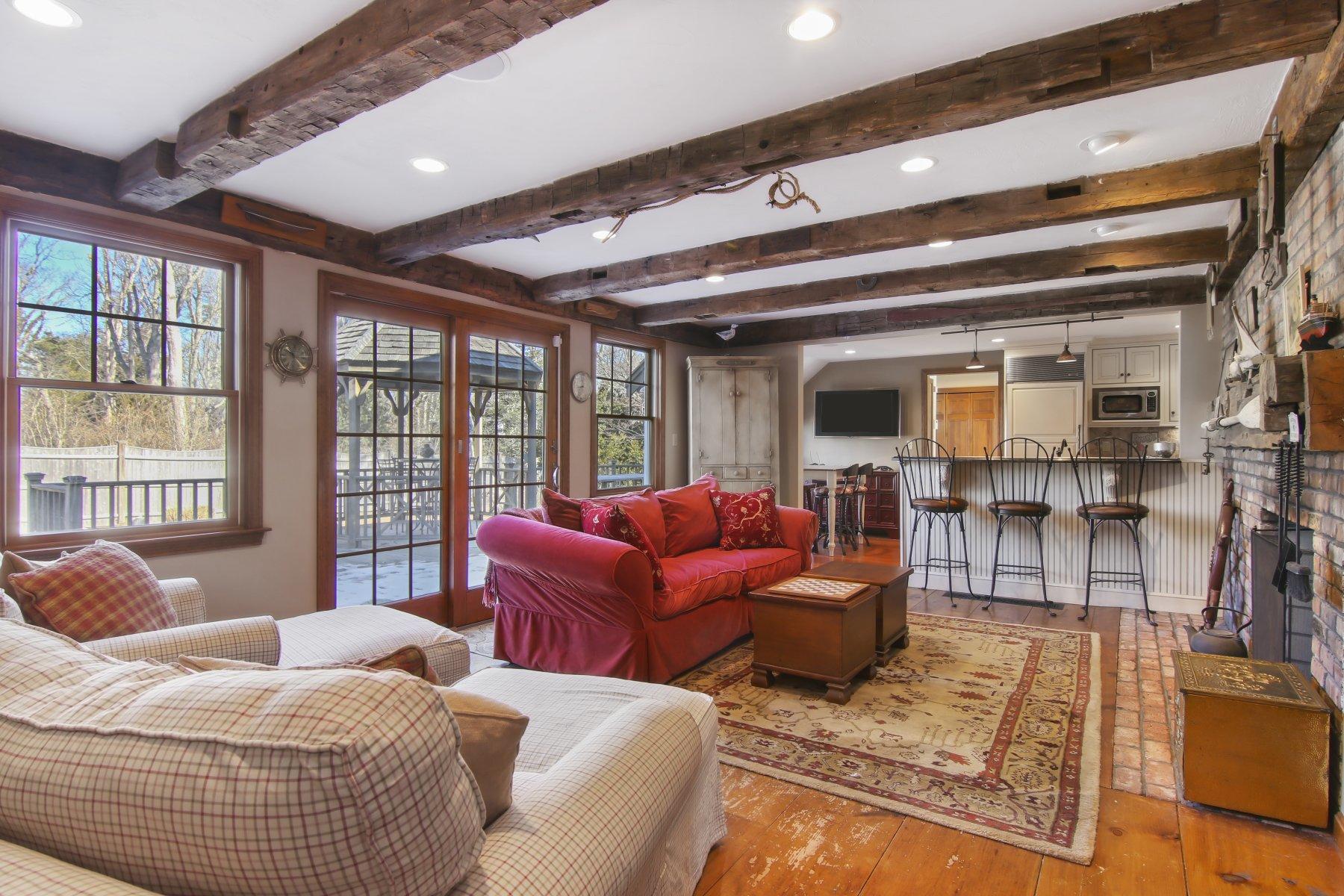 4 Shapquit Bars Road Falmouth, MA 02540 - Photo 10 of 45 a living room with furniture and a window
