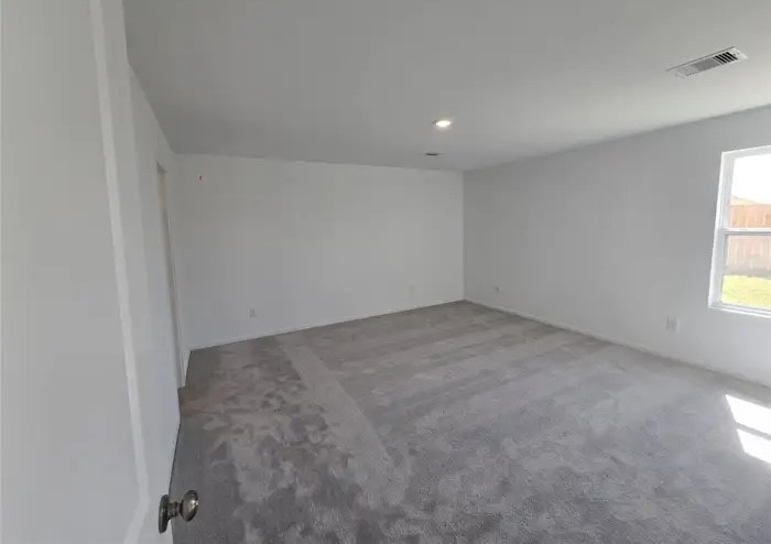 16059 Tallis Drive Conroe, TX 77303 - Photo 9 of 10 an empty room with a windows