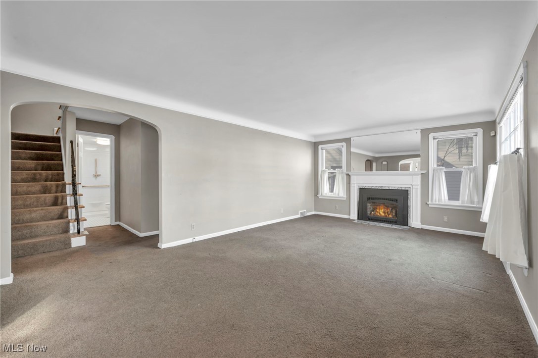 1688 Rushton Road Cleveland, OH 44121 - Photo 2 of 39 Unfurnished living room with dark colored carpet
