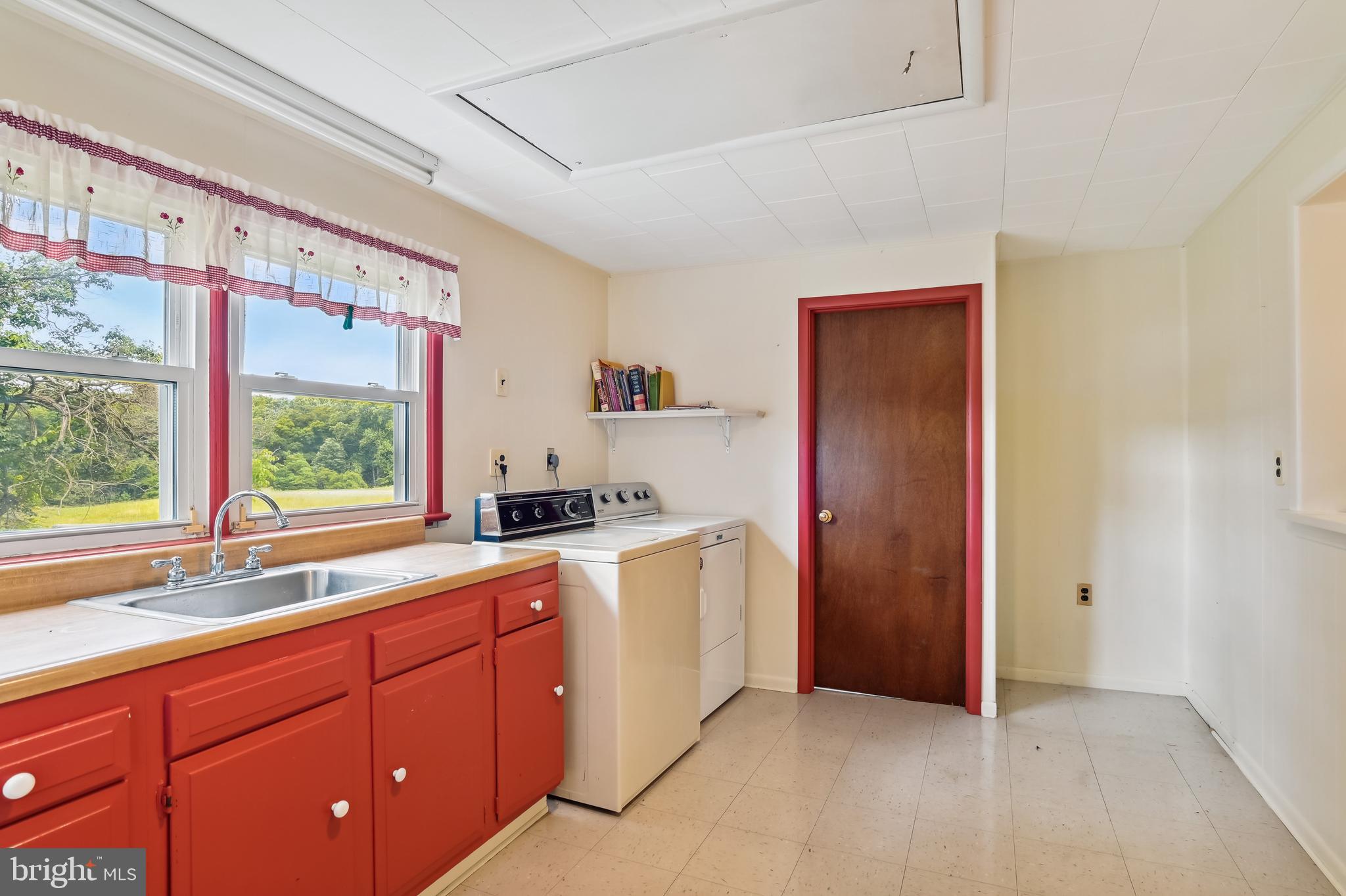 4475 Muddy Creek Road Harwood, MD 20776 - Photo 24 of 59 Large Laundry with Sink & Built-In Cabinetry