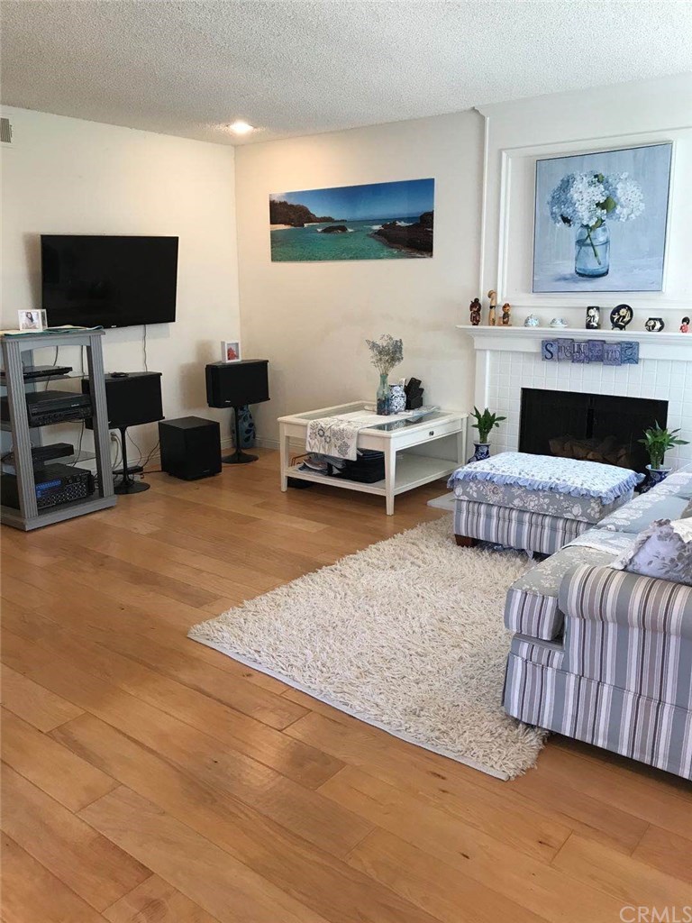 14 Columbia Irvine, CA 92612 - Photo 7 of 12 a living room with furniture and a flat screen tv