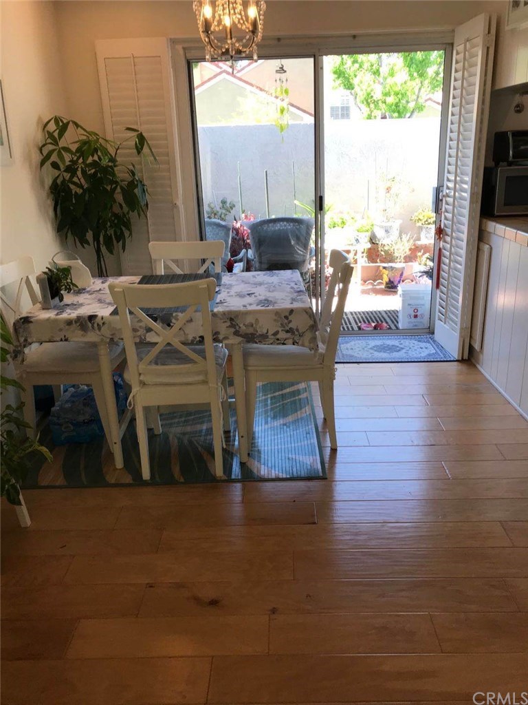 14 Columbia Irvine, CA 92612 - Photo 8 of 12 a living room with furniture wooden floor and a floor to ceiling window