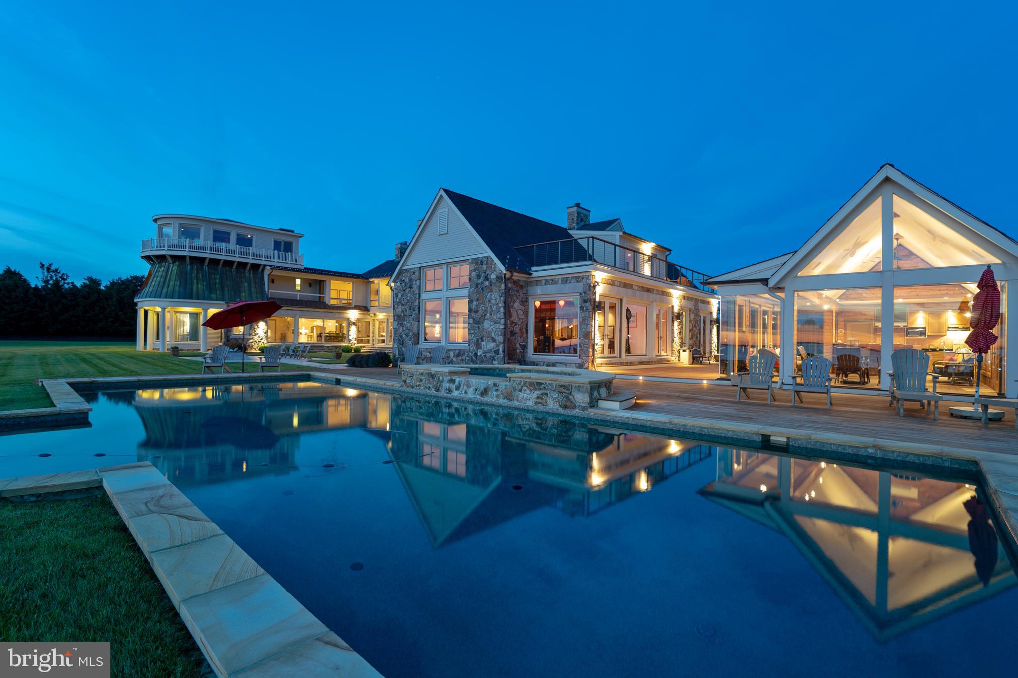 7402 Kent Point Road Stevensville, MD 21666 - Photo 11 of 134 Dusk view of pool house reflecting in pool