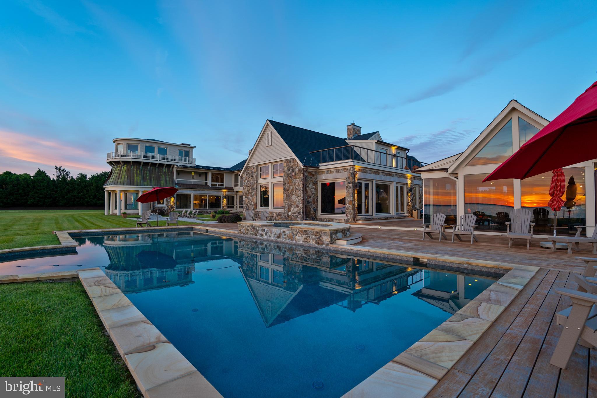 7402 Kent Point Road Stevensville, MD 21666 - Photo 3 of 134 Sunset reflecting in pool house windows from deck