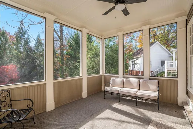 a bathroom with a toilet a sink and shower curtain