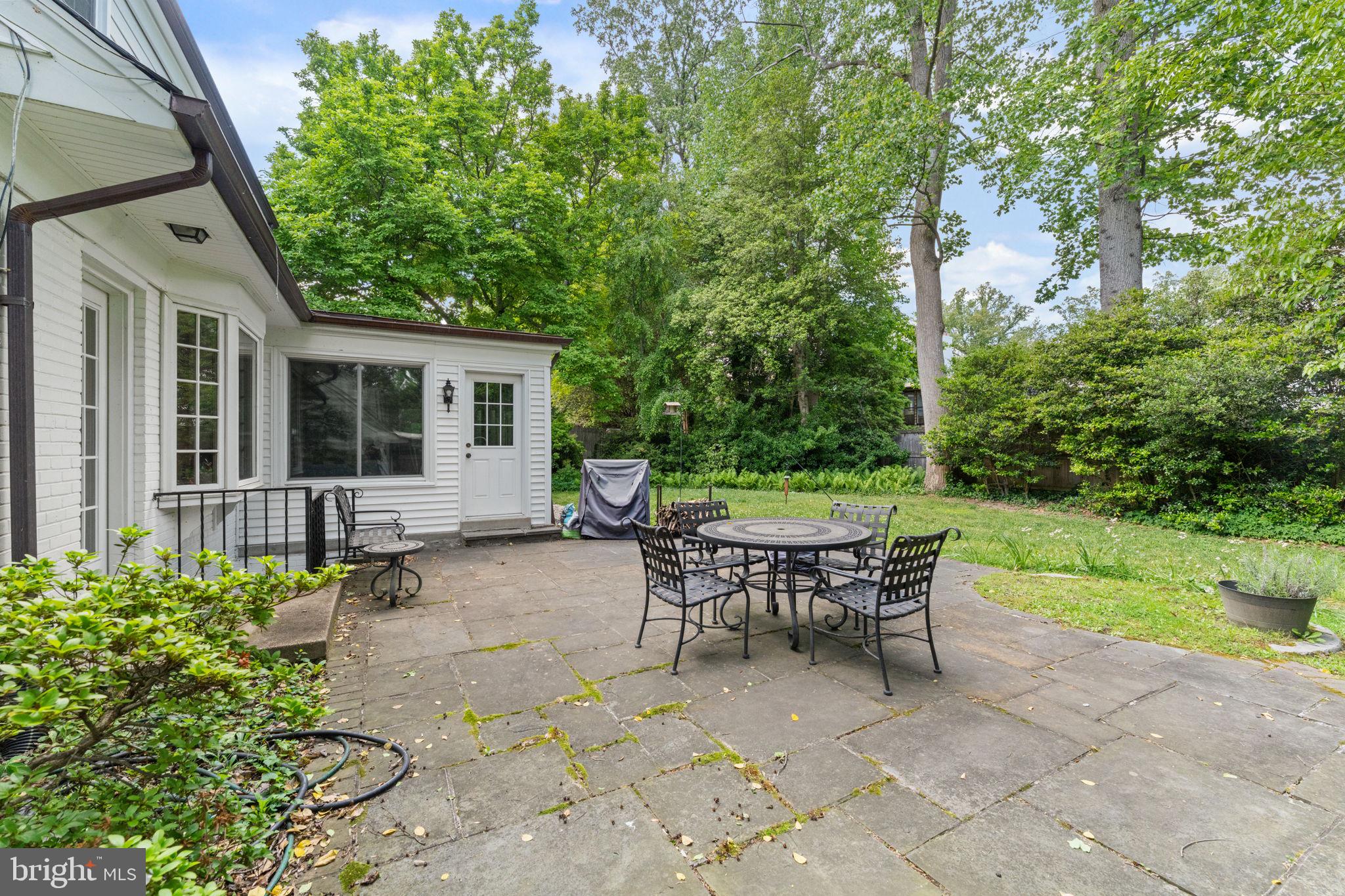 5121 Baltan Road Bethesda, MD 20816 - Photo 48 of 54 Serene patio surrounded by lush greenery.
