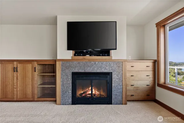 a view of a big room with windows and city view